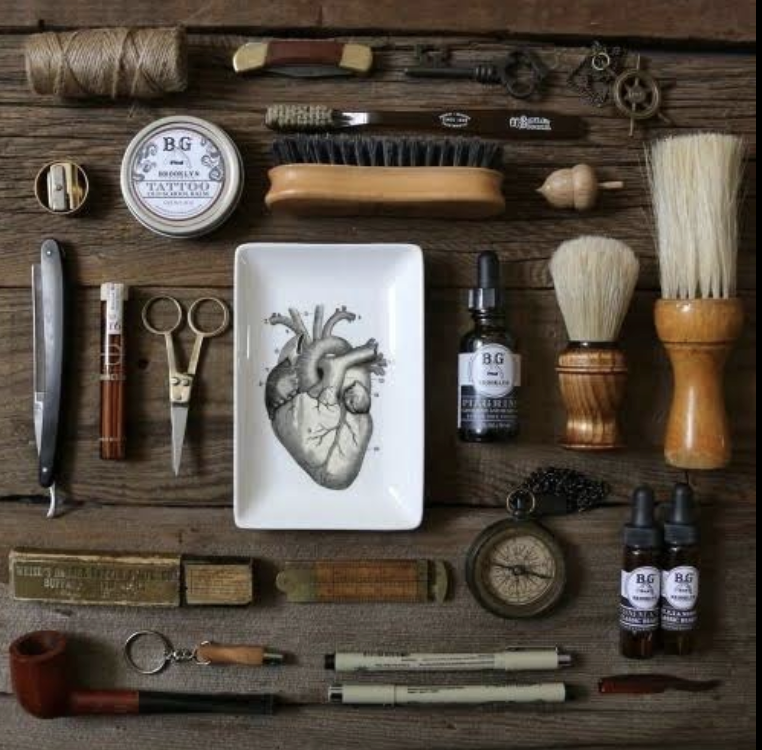 Classic barber tools arranged on a wooden bench