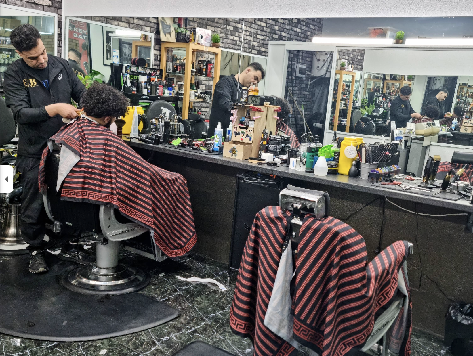 Berberi Barbers shop interior with barber chairs and grooming tools